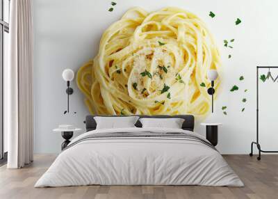 fettuccine alfredo with a rich, creamy sauce and topped with parsley against an isolated white background Wall mural