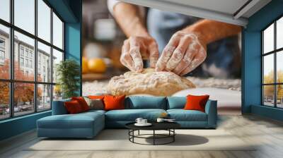 a bakerâ€™s hands carefully kneading dough on a floured surface, with an open recipe book nearby, illustrating the art of homemade baking in a bright, natural kitchen environment Wall mural