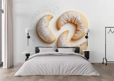 a batch of vanilla crescent cookies with a light dusting of powdered sugar against an isolated white background Wall mural