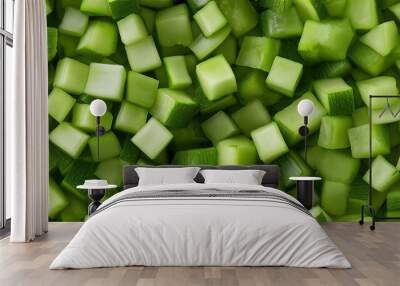 a close-up, top-down view of diced zucchini spread across the entire frame, filling the image with their light green color and uniform cubic shapes Wall mural