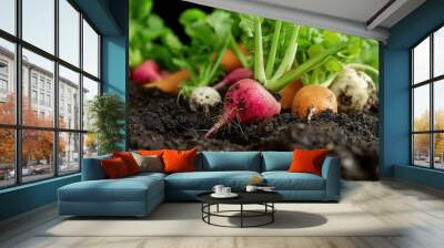 a close-up of freshly harvested vegetables lying on the rich, dark soil Wall mural