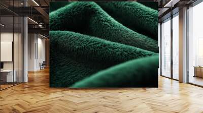 a meticulously styled close-up of a forest green fleece fabric, emphasizing its luxurious softness and fluffy texture, the carefully arranged fibers create an elegant, inviting atmosphere Wall mural