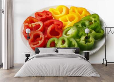 a plate of bell pepper slices in red, yellow, and green against an isolated white background Wall mural