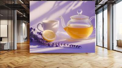 a teapot and cup of earl grey tea with a slice of lemon and a sprig of lavender against an isolated soft lavender background Wall mural