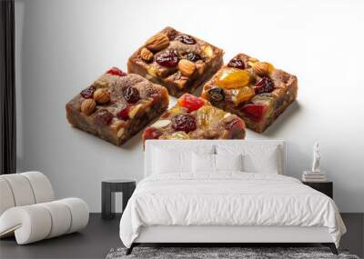 fruitcake slices with vibrant candied fruits and nuts against an isolated white background Wall mural