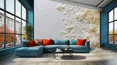 jasmine rice grains: a loose frame made from uncooked jasmine rice grains, scattered gracefully on a light-gray background, the ivory grains add a subtle, pure texture Wall mural