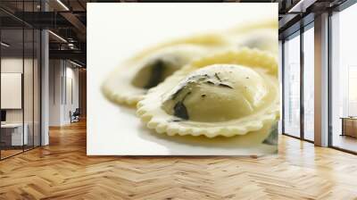 ravioli with spinach and ricotta filling with a light butter sage sauce against an isolated white background Wall mural