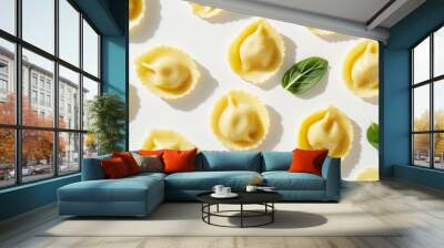 ravioli with spinach and ricotta filling with a light butter sage sauce against an isolated white background Wall mural