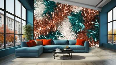 shimmering tinsel garland texture with a blend of metallic copper, deep teal and white strands Wall mural