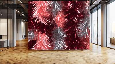 shimmering tinsel garland texture with a blend of metallic dark red, peach and light gray strands Wall mural