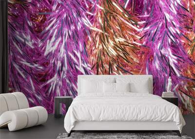 shimmering tinsel garland texture with a blend of metallic lilac, pink and gold strands Wall mural