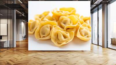 tortellini with prosciutto and cream sauce with a light dusting of nutmeg against an isolated white background Wall mural