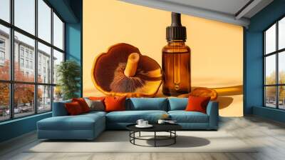 whole reishi mushrooms with a bottle of liquid reishi extract with a dropper against an isolated light yellow background Wall mural