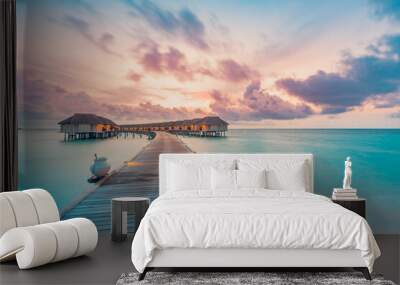 Amazing beach landscape. Beautiful Maldives sunset seascape view. Horizon colorful sea sky clouds, over water villa pier pathway. Tranquil island lagoon, tourism travel background. Exotic vacation
 Wall mural