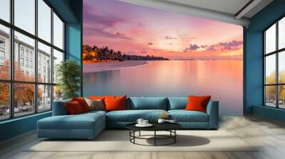 Beautiful panoramic sunset tropical paradise beach. Tranquil summer vacation or holiday landscape. Exotic sunrise beach seaside palm trees silhouette sea bay view inspirational seascape and sky clouds Wall mural