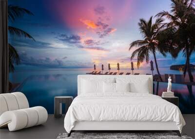 Beautiful poolside and sunset sky. Luxurious tropical beach landscape, deck chairs and loungers and water reflection Wall mural