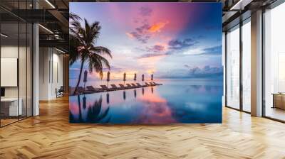 Beautiful poolside and sunset sky. Luxurious tropical beach landscape, deck chairs and loungers and water reflection Wall mural