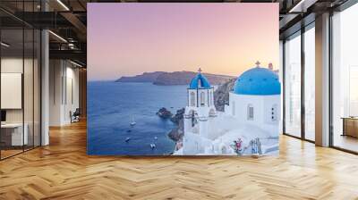 Fantastic Mediterranean Santorini island, Greece. Amazing romantic sunrise in Oia background, morning light. Amazing sunset view with white houses blue domes. Panoramic travel landscape. Lovers island Wall mural