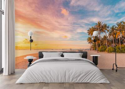 Island palm tree sea sand beach. Panoramic beach landscape. Inspire tropical beach seascape horizon. Orange and golden sunset sky calmness tranquil relaxing summer mood. Vacation travel holiday banner Wall mural