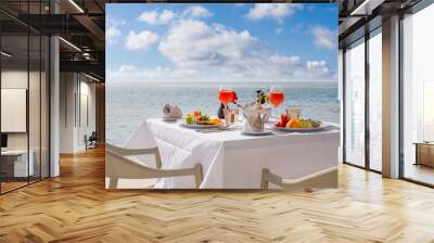 Luxury breakfast table with food for two with beautiful tropical sea view background. Morning couple time summer holiday and romantic vacation concept, luxury travel and lifestyle, destination dining Wall mural