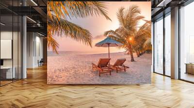 Luxury panoramic tropical sunset beach banner. Two sun beds loungers, umbrella under palm tree. White sand, sea horizon wide view, colorful sky calmness and relax vacation. Travel inspire resort hotel Wall mural