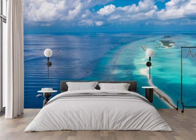 Maldives beach from birds eye view. Aerial view on Maldives island, Ari atoll. Tropical islands and atolls in Maldives from aerial view. Summer holiday beach landscape background in Maldives. Wall mural