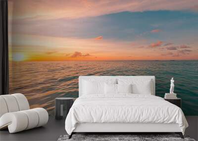 Relaxing seascape with wide horizon of the sky and the sea. Beautiful seascape panorama. Cloudy sky with relaxing reflection, calm ocean water. Sunlight, coast shore of island beach Wall mural