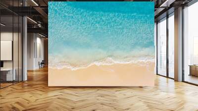 Summer seascape beautiful waves, blue sea water in sunny day. Top view from drone. Sea aerial view, amazing tropical nature background. Beautiful bright sea with waves splashing and beach sand concept Wall mural