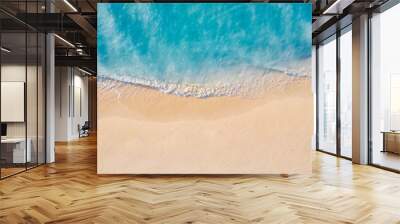 Summer seascape beautiful waves, blue sea water in sunny day. Top view from drone. Sea aerial view, amazing tropical nature background. Beautiful bright sea with waves splashing and beach sand concept Wall mural