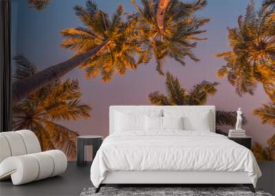 Tranquil nature pattern, palm trees with sunset sky. Romantic, relaxing natural scenic, tropical paradise. Island beach, artistic view. Beautiful leaves, coconut trees. Summer vacation panorama Wall mural