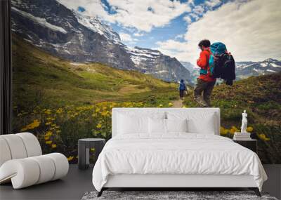 Activity sports. Hiking on a beautiful sunny summer day. Scenic panoramic landscape in the background Wall mural