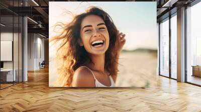 happy beautiful young woman enjoying sunny day and smiling by the beachside Wall mural