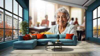 happy smiling senior latin woman portrait in a nursing home blurry background Wall mural