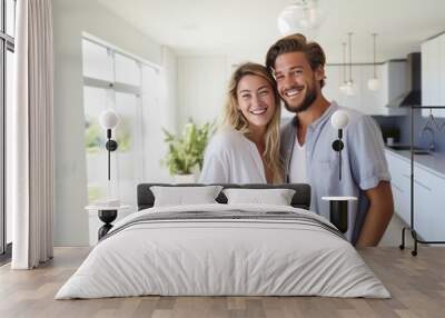 happy young smiling couple moves to new apartment Wall mural