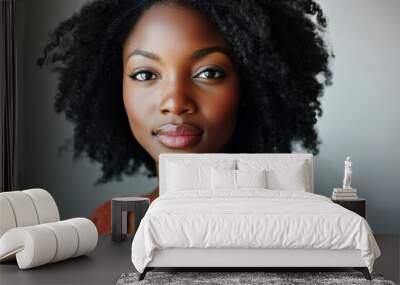 portrait of a confident african american woman with natural curly hair and warm expression wearing a lace top, showcasing empowerment and beauty in diversity Wall mural