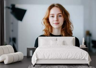 portrait of a young woman in a photography studio, casual and confident female model with soft lighting and minimalist background Wall mural