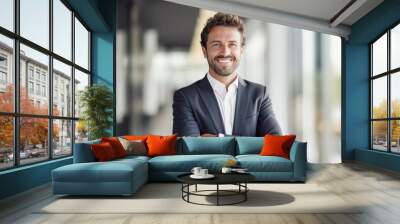 portrait of successful senior businessman consultant looking at camera and smiling inside modern office building Wall mural