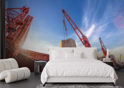 heavy lift cargo unit is on/off-loading discharging loading operation handle by the jumbo heavy crane of the ship to delivery the shipment to destination by sea and land transports Wall mural