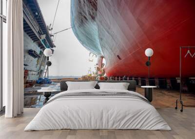 the floating dock terminal and bottom layer of the commcercial ship sitting on the concrete supporters to takes to ship stay in stable status during repair in floating dock yard Wall mural