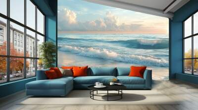 A serene seascape with a sandy beach, foamy waves, and a beautiful sunset sky. Wall mural