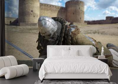 Medieval warrior defeated lying inside the fortress Wall mural