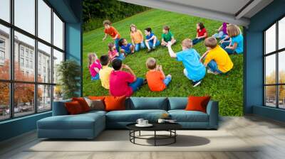 Group of Kids Playing a Game in a Circle Outside Wall mural