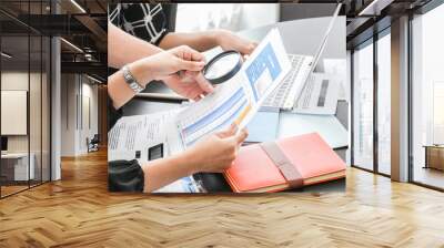 Group of business people working together to analyze and examine the statistical documents on the desk in the Office. Business success. Wall mural