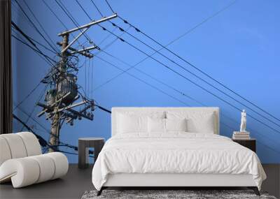 electricity transmission pylon against blue sky Wall mural