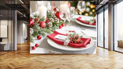 A table with a red napkin and a white plate with a red flower on it Wall mural