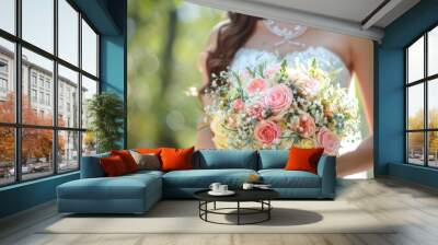 A woman is holding a bouquet of flowers in her hand Wall mural