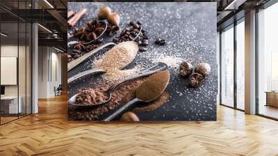 Chocolate powder cocoa and coffee spoons on the table Wall mural