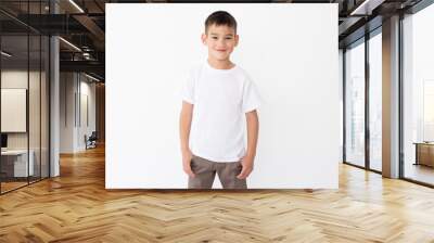 Cute little boy wearing blank white t shirt on a white background Wall mural