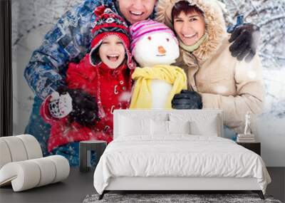 Happy family with snowman Wall mural