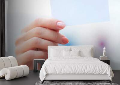 white card in a hand Wall mural